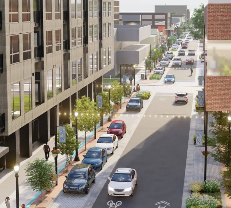3D rendering of a modern downtown street with mid-rise buildings, trees, lampposts and string lights, angled street parking, a bike symbol on the roadway, and pedestrians on wide sidewalks.