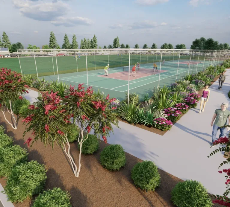 Rendering of a landscaped park with multiple fenced pickleball courts in use, bordered by colorful flower beds and a pedestrian path where people walk beneath tall trees on a sunny day.
