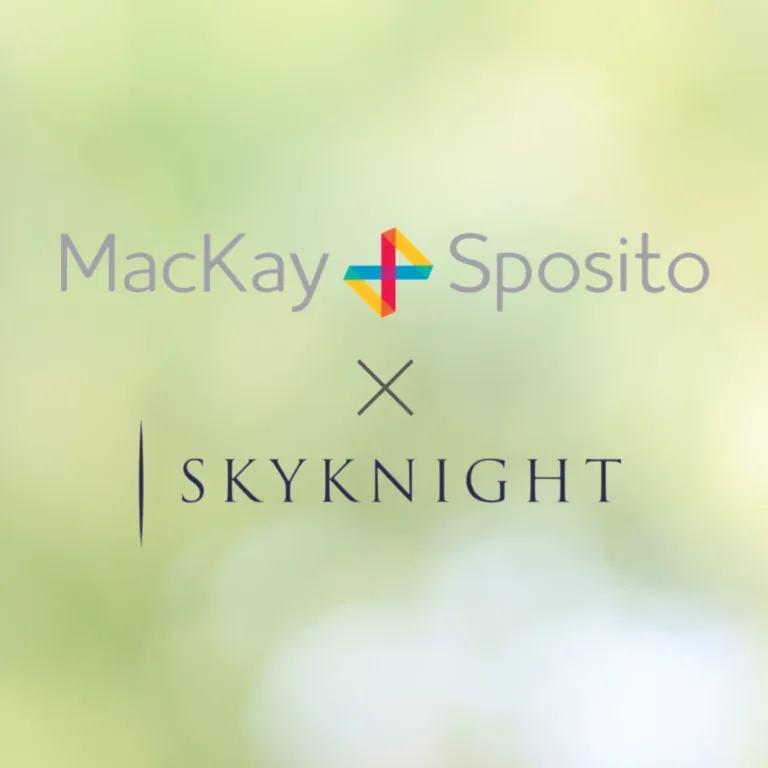 MacKay Sposito × SkyKnight logos on a soft green blurred background, signaling a partnership.