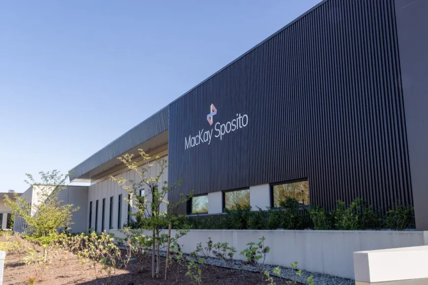 Exterior of MacKay Sposito office with concrete finishes and vertical windows